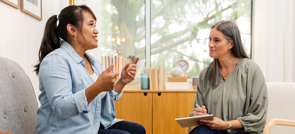 Counselor working with client in person